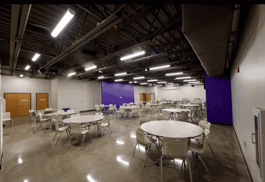 The Village Den set up with round banquet tables